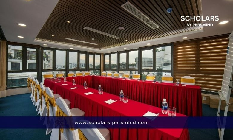 Conference meeting room prepared for the Youth World Summit, featuring arranged tables with red covers, chairs with golden ribbons, and training materials set up for participants.