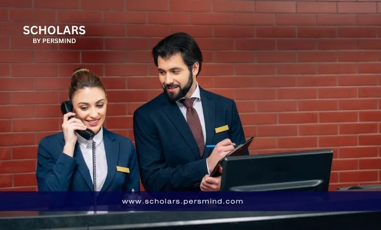 Hotel reception staff assisting guests and handling calls at the front desk